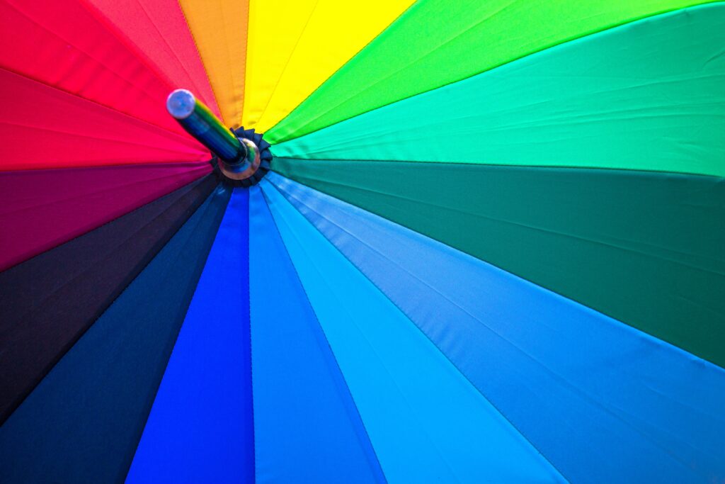 Vivid Macro Shot of Rainbow Umbrella Patterns - Wallpaper Background