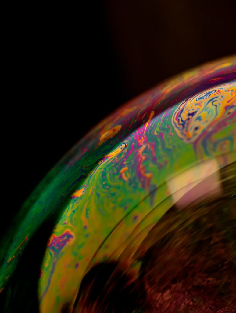 Vibrant Macro Soap Bubble Wallpaper - Colorful Swirling Patterns