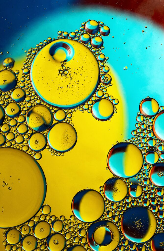 Vibrant Macro Wallpaper: Colorful Oil Bubbles in Liquid Background