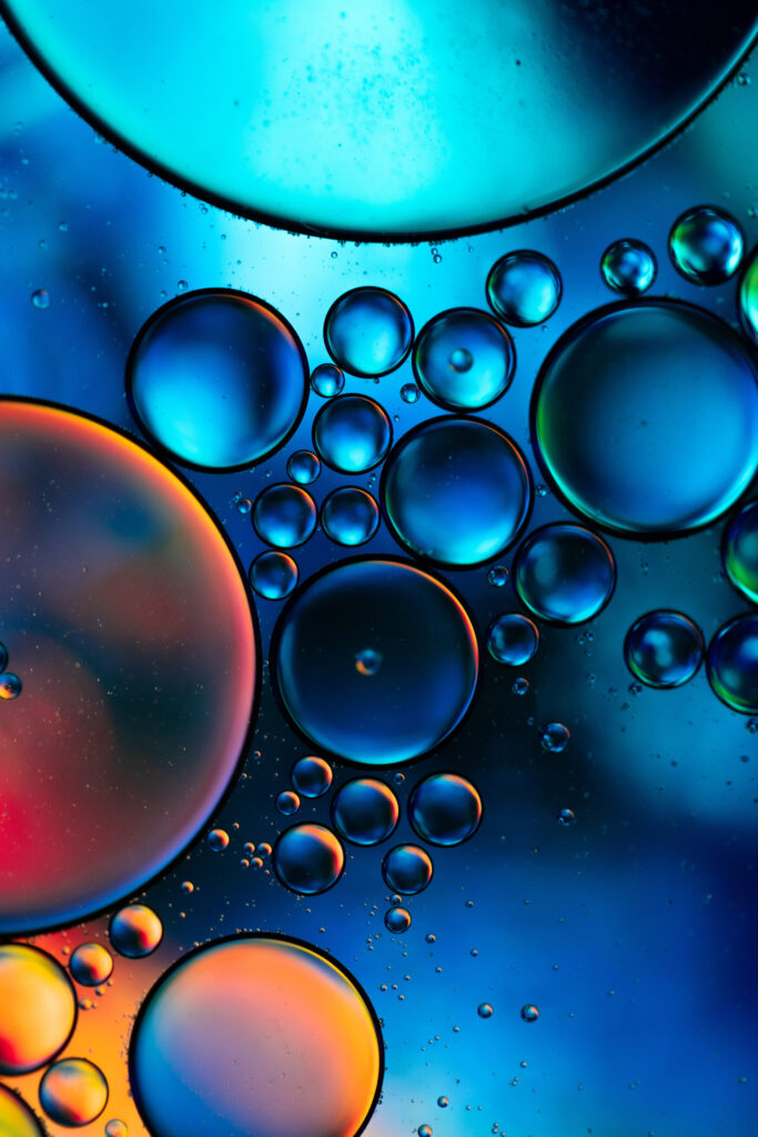 Vibrant Macro Wallpaper: Colorful Oil Bubbles in Liquid Background