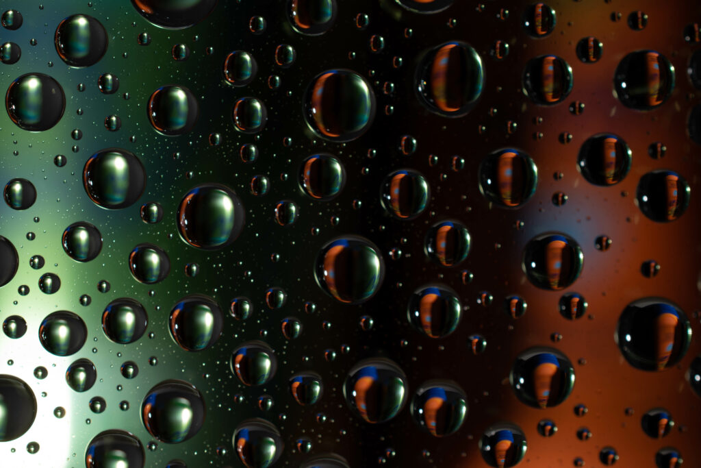 Vibrant Macro Wallpaper of Glossy Liquid Bubbles & Colorful Light