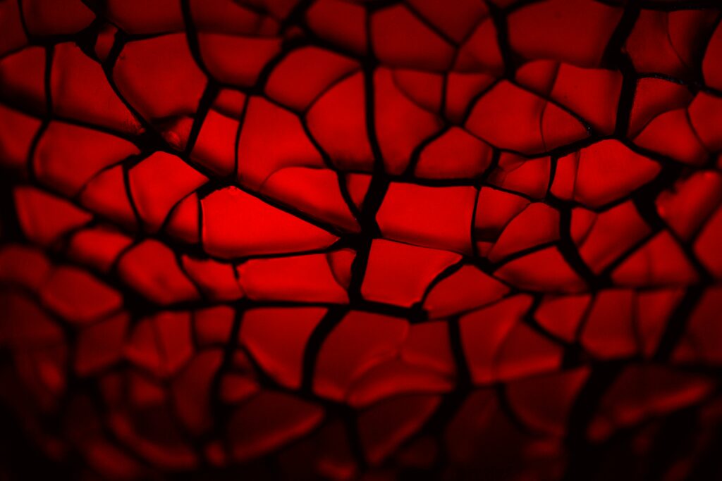 Vibrant Macro Wallpaper: Intricate Red Glass Shards Background