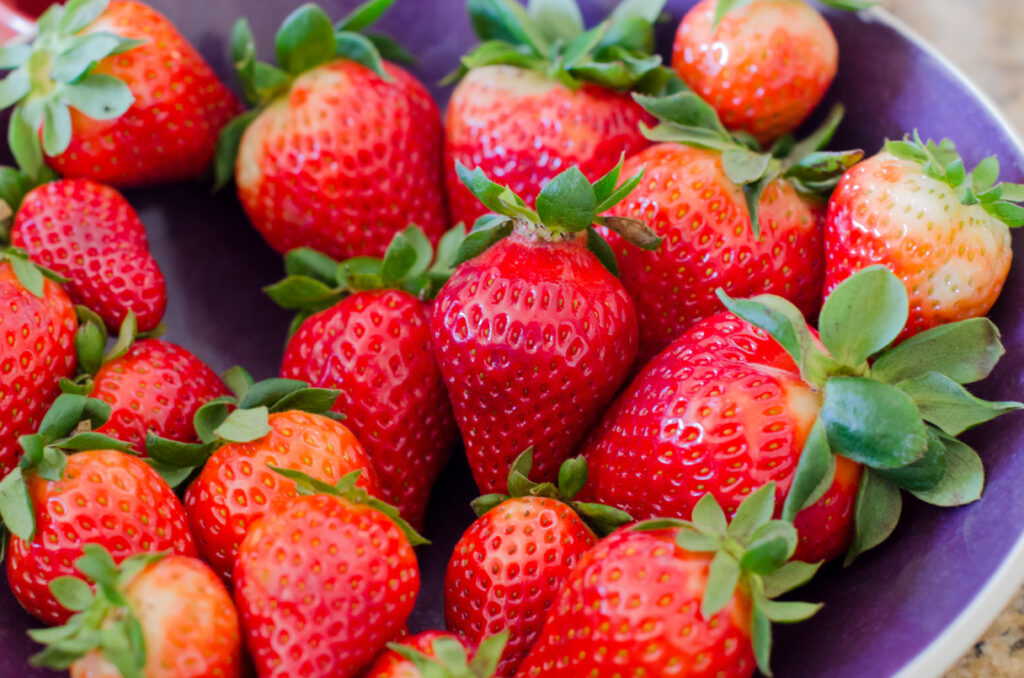 Vibrant Macro Shot of Juicy Red Strawberries - Fresh Wallpaper Background