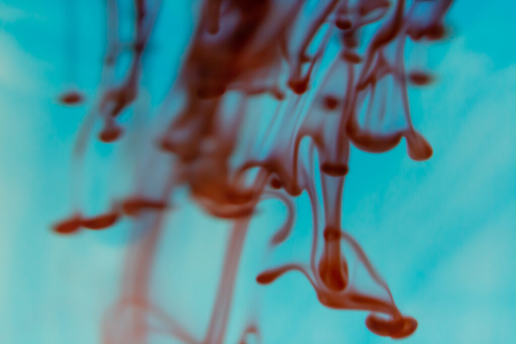 Vibrant Ink Swirls Macro Wallpaper - Intricate Patterns on Blue