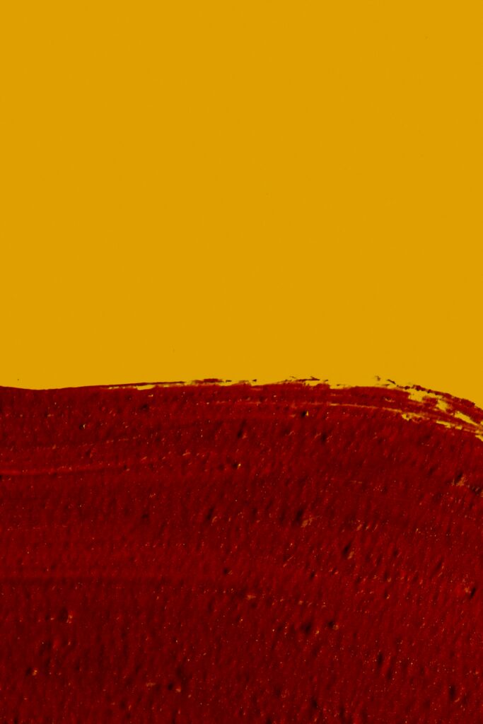 Vibrant Macro Paint Wallpaper: Bold Red & Yellow Texture Background