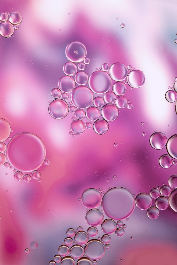 Mesmerizing Liquid Effect: Vibrant Pink & Purple Bubbles Wallpaper