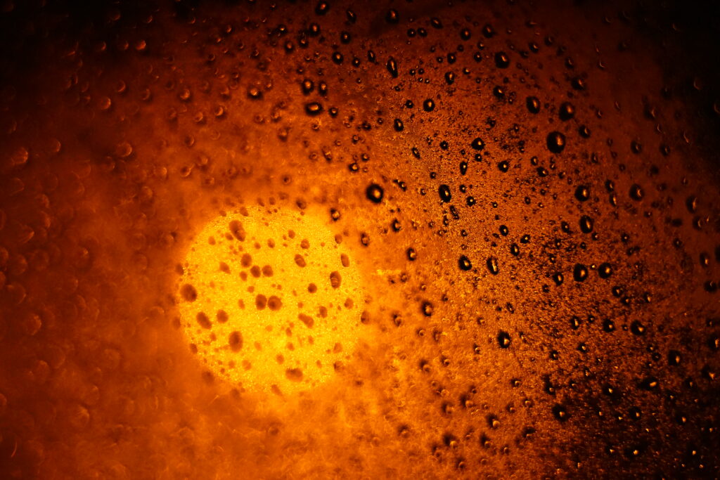 Vibrant Water Drop Macro Wallpaper: Warm Light Texture