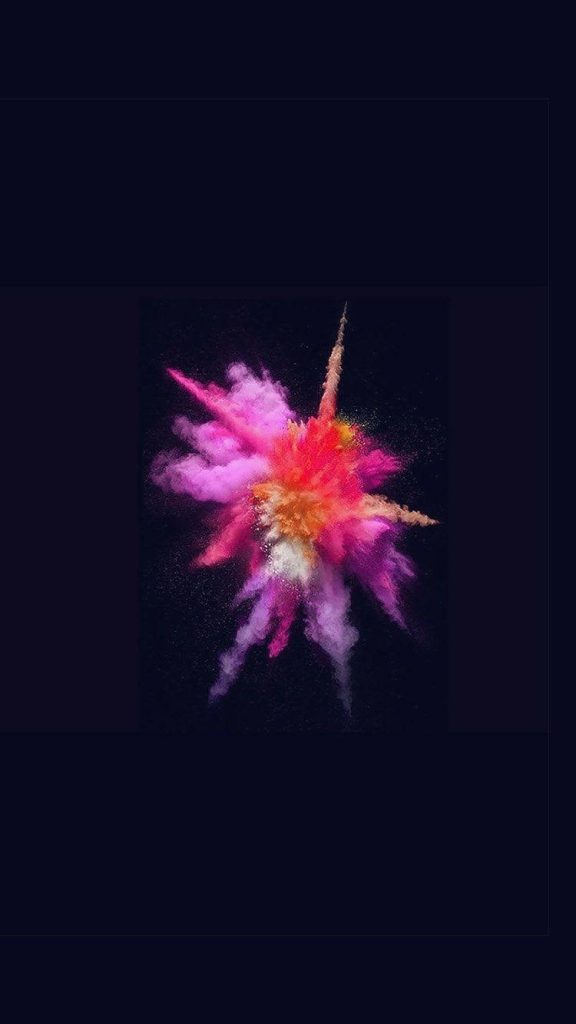 Vibrant magenta pink and orange powder explosion wallpaper on black background iOS style