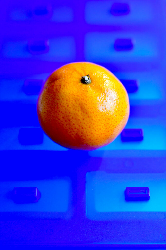 Vivid Mandarin Orange Wallpaper on Bold Blue Background