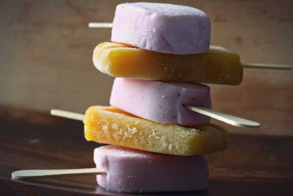 Vibrant Mango & Strawberry Ice Lollies Wallpaper Background