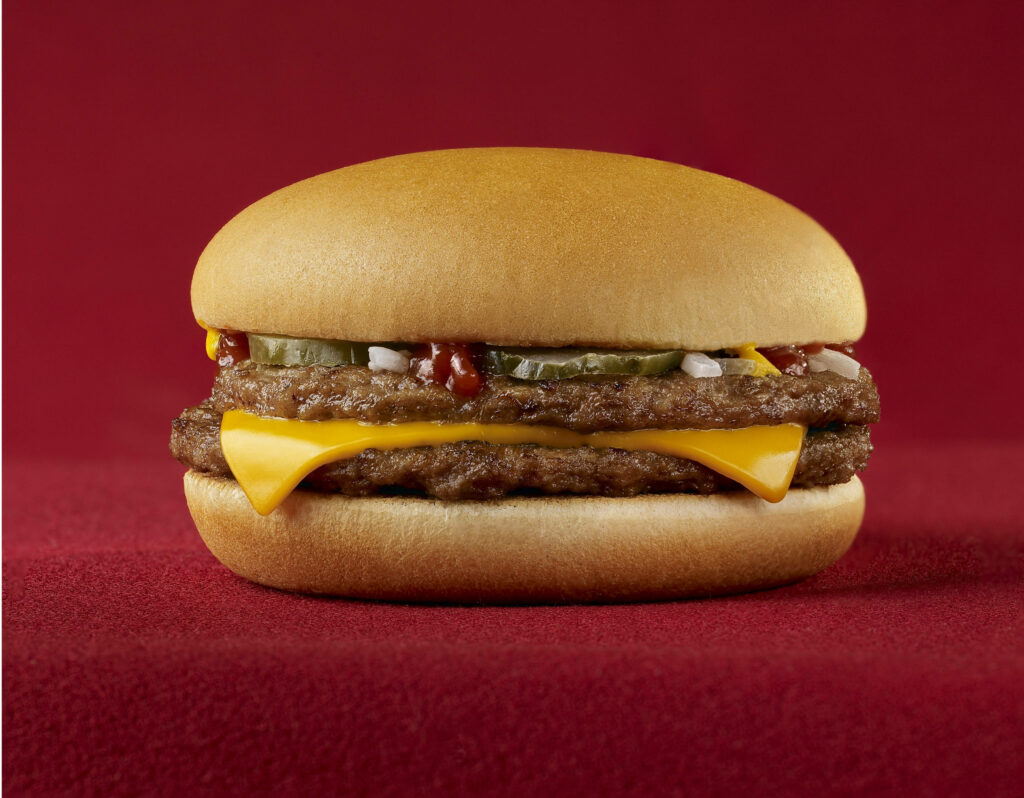 Close-Up McDonald's Cheeseburger Wallpaper: Cheese, Beef & Pickles