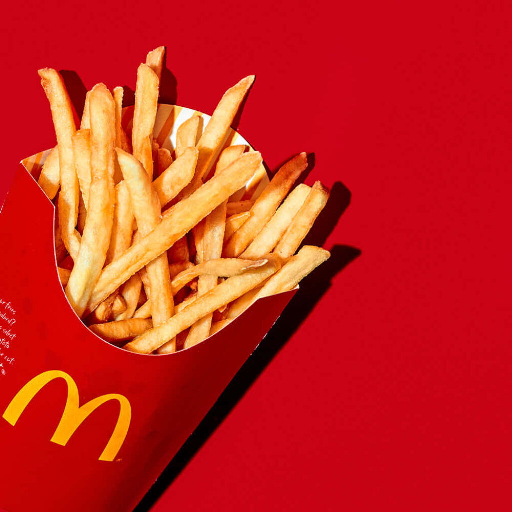 Iconic McDonald's French Fries Wallpaper Background in Bold Red
