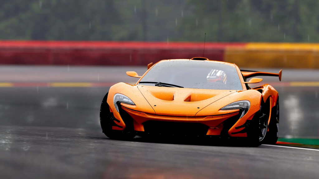 Dynamic Orange McLaren F1 Wallpaper: Speed on a Wet Track