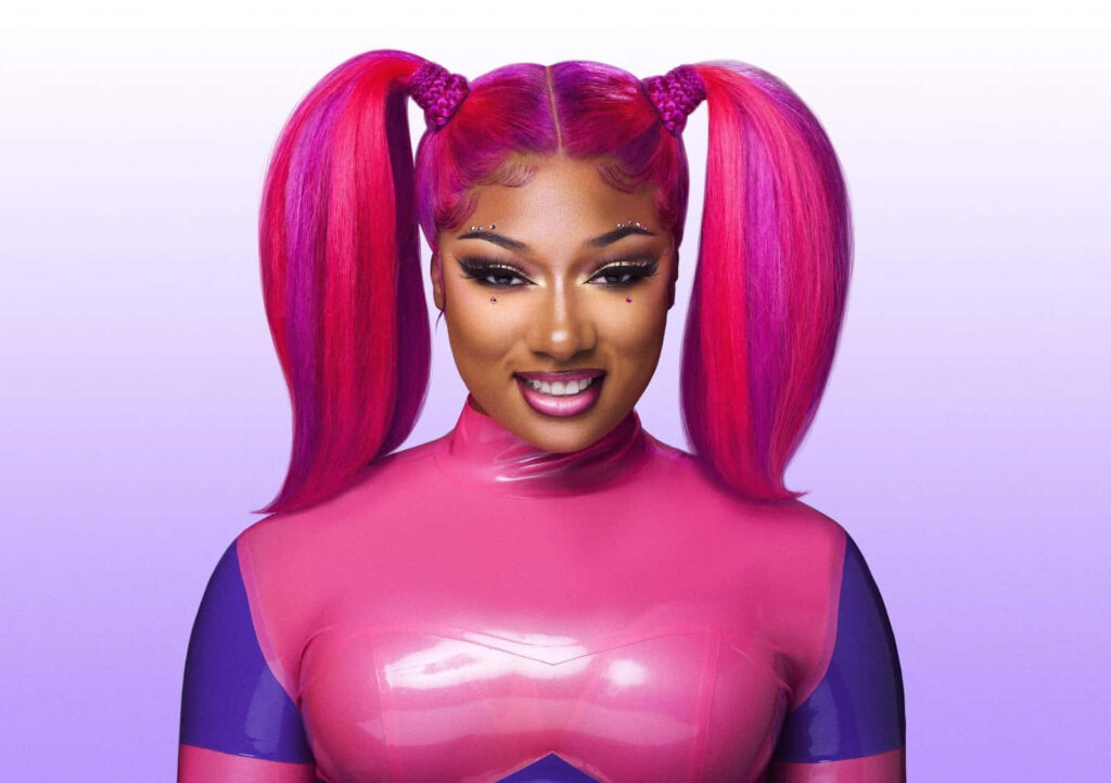 Vibrant Wallpaper of Megan Thee Stallion: Bold Style & Pink Hair
