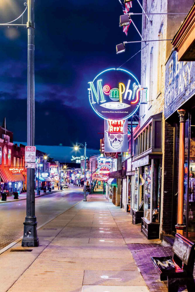 Vibrant Memphis Street Night Wallpaper with Neon Signs