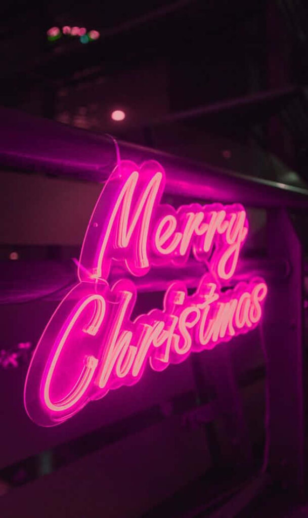 Bright Pink Neon Merry Christmas Wallpaper for a Festive Vibe