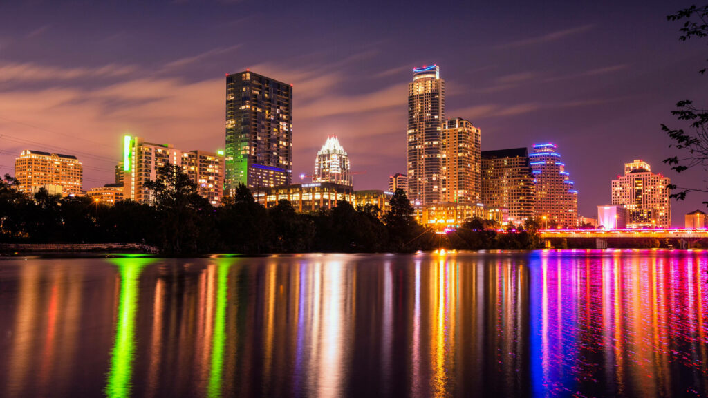Vibrant Urban Tapestry: Captivating Waterfront Metropolis Wallpaper