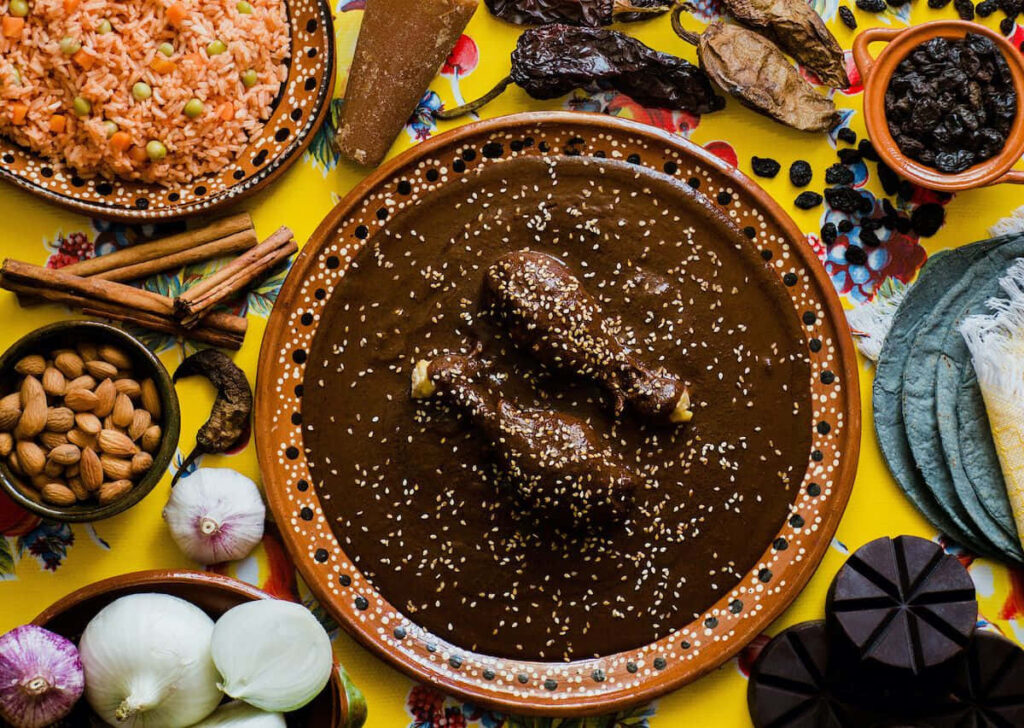 Vibrant Mexican Food Table with Mole, Rice & Tortillas - Wallpaper