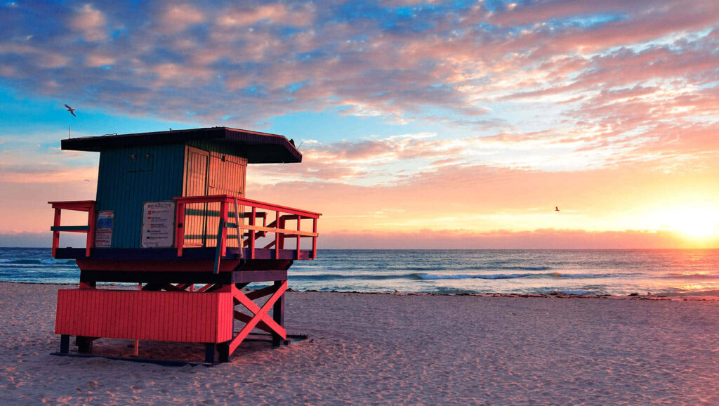 Vibrant Miami Beach Sunset Wallpaper: Colorful Lifeguard Tower Scene