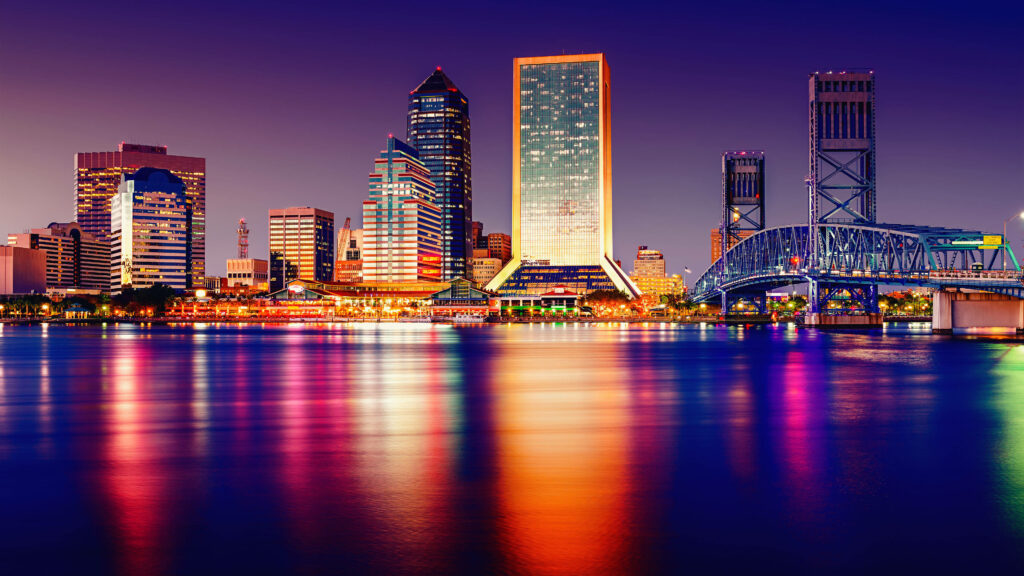 Miami skyline at night vibrant colorful lights reflecting on water Florida cityscape wallpaper