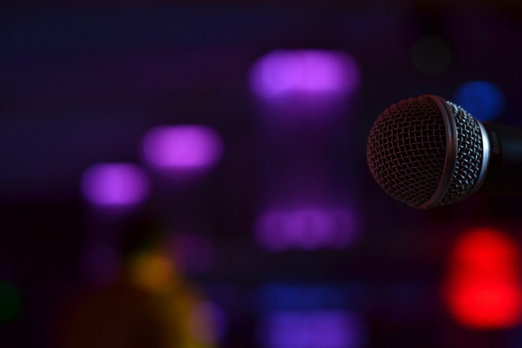 Close-Up Microphone Wallpaper: Vibrant Purple Lights & Sound Atmosphere