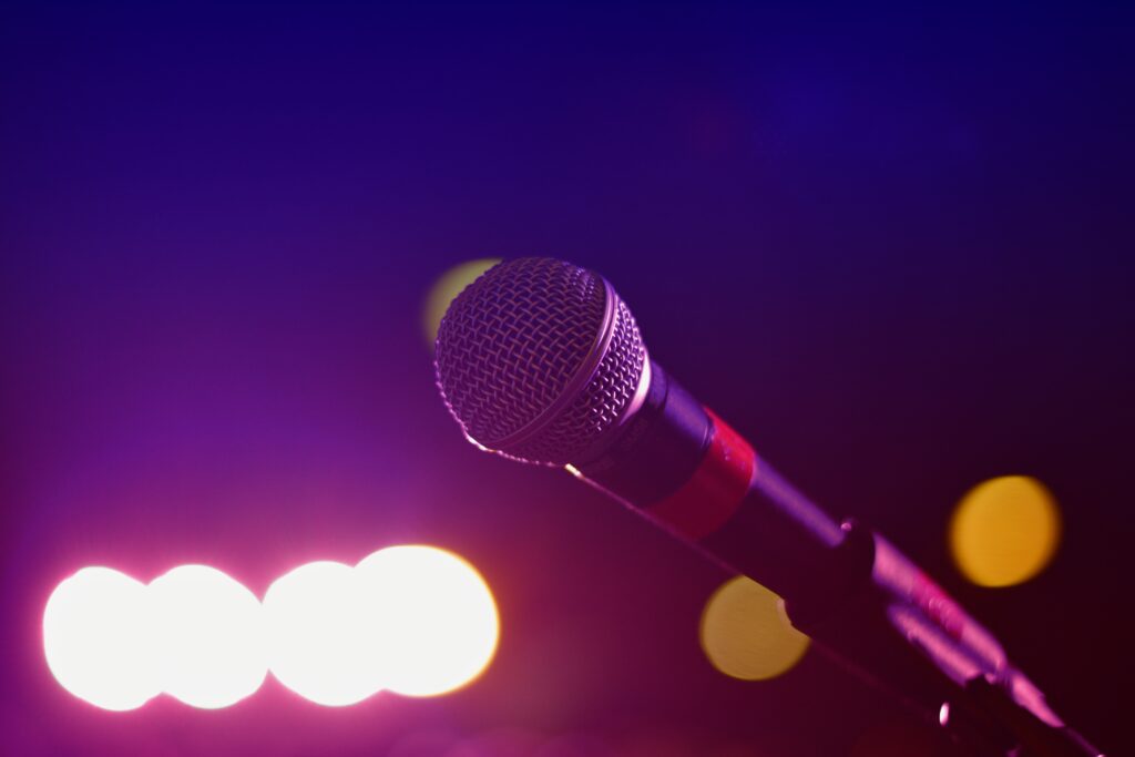 Vibrant Wallpaper: Close-Up Microphone on Stand with Colorful Lights