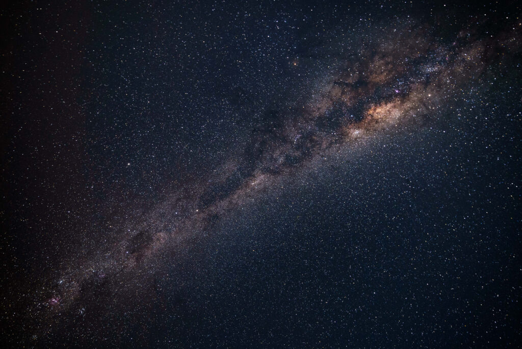 Vibrant Milky Way galaxy wallpaper with stars, nebulae, and cosmic dust in dark space.