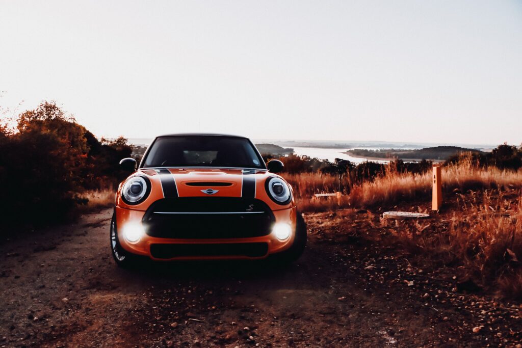 Vibrant Mini Cooper S Front View Wallpaper with Scenic Background