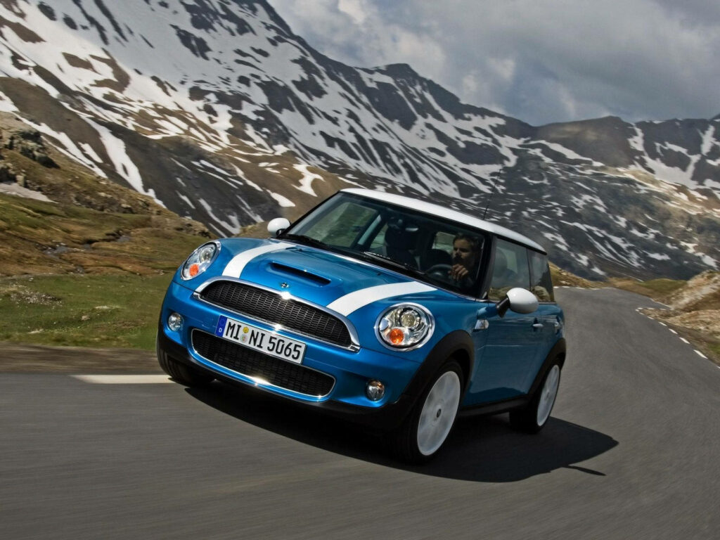 Vibrant Blue Mini Cooper Wallpaper in Scenic Mountain Landscape