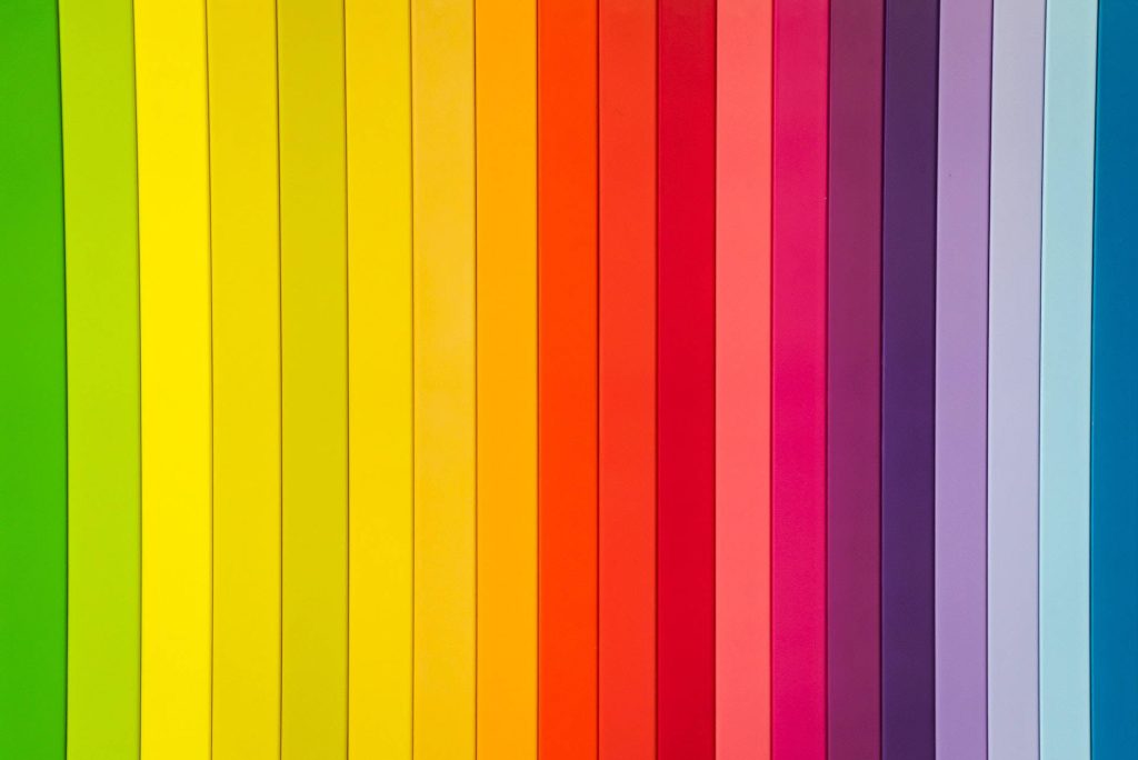 Vibrant minimalist wallpaper with vertical rainbow gradient lines in bright modern colors background