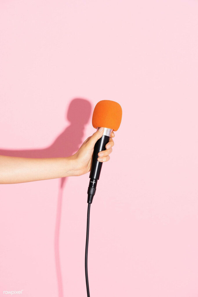 Vibrant Minimalistic Music Aesthetic Wallpaper: Hand & Black Microphone