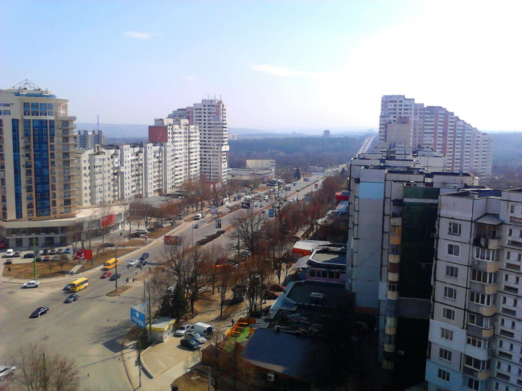 Vibrant Moldova Cityscape: Low-Rise Architecture & Bustling Streets Wallpaper