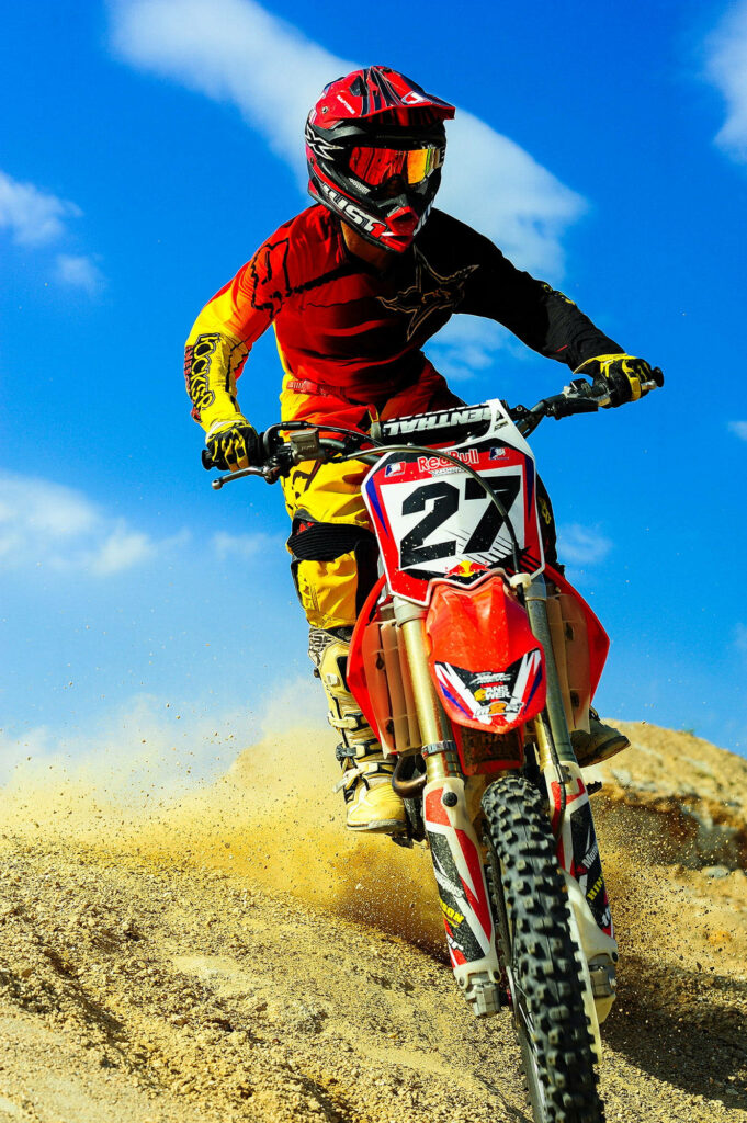 Vibrant Motocross Wallpaper: Rider 27 Racing Thrills in Bold Colors