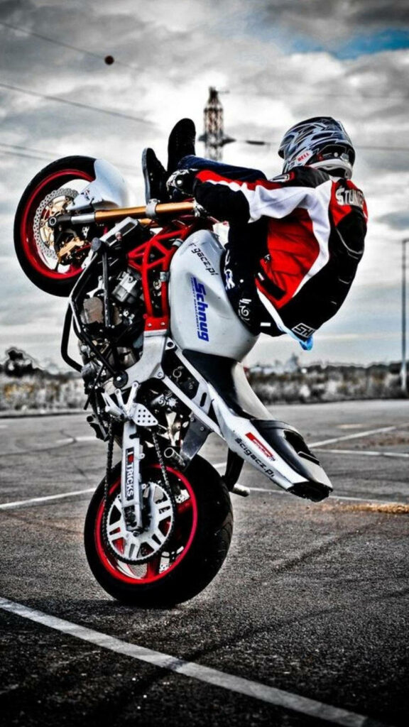 Thrilling Motorbike Stunt Wallpaper: Bold Balance & Urban Vibes
