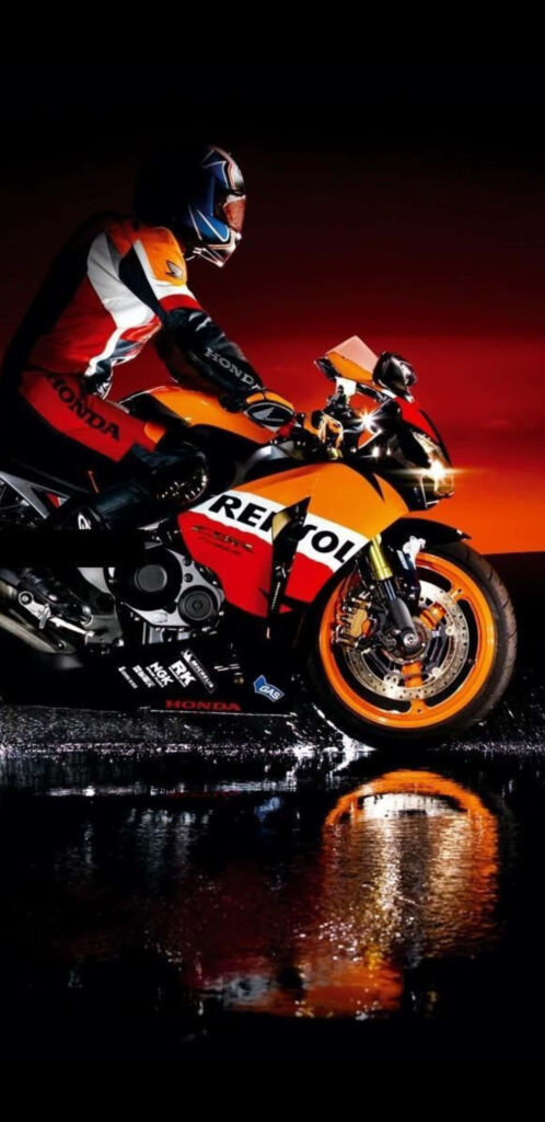 Vibrant Motorcycle Rider Wallpaper: Night Ride with Honda Reflection