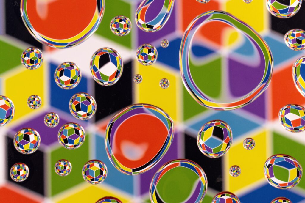 Colorful Bubble Wallpaper: Vibrant Reflections on Geometric Background