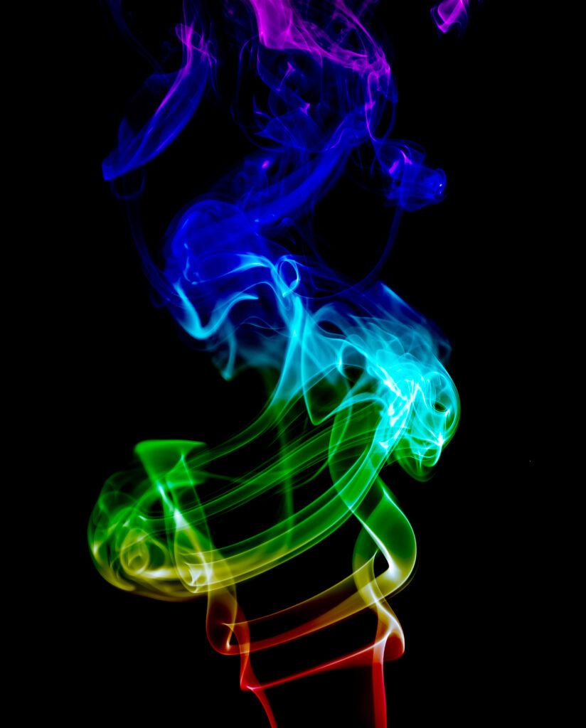 Vibrant Smoke Rings on Dark Background - Mesmerizing Wallpaper