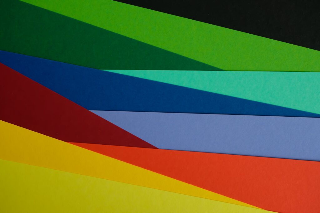 Vibrant Multicolored Wallpaper: Dynamic Diagonal Paper Strips Background