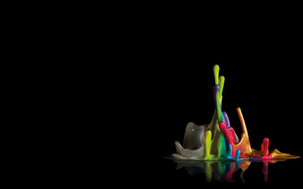 Vibrant Multicolored Wax Drops Wallpaper on Dark Background