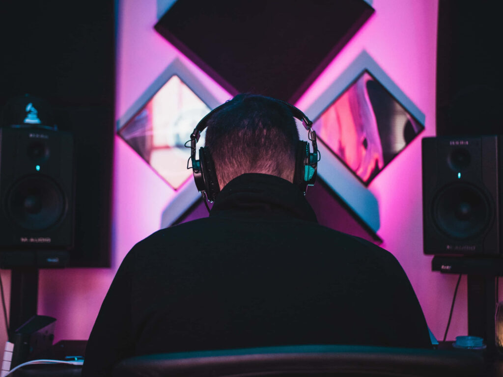 Neon-Lit Music Producer Wallpaper: Creative Studio Vibes
