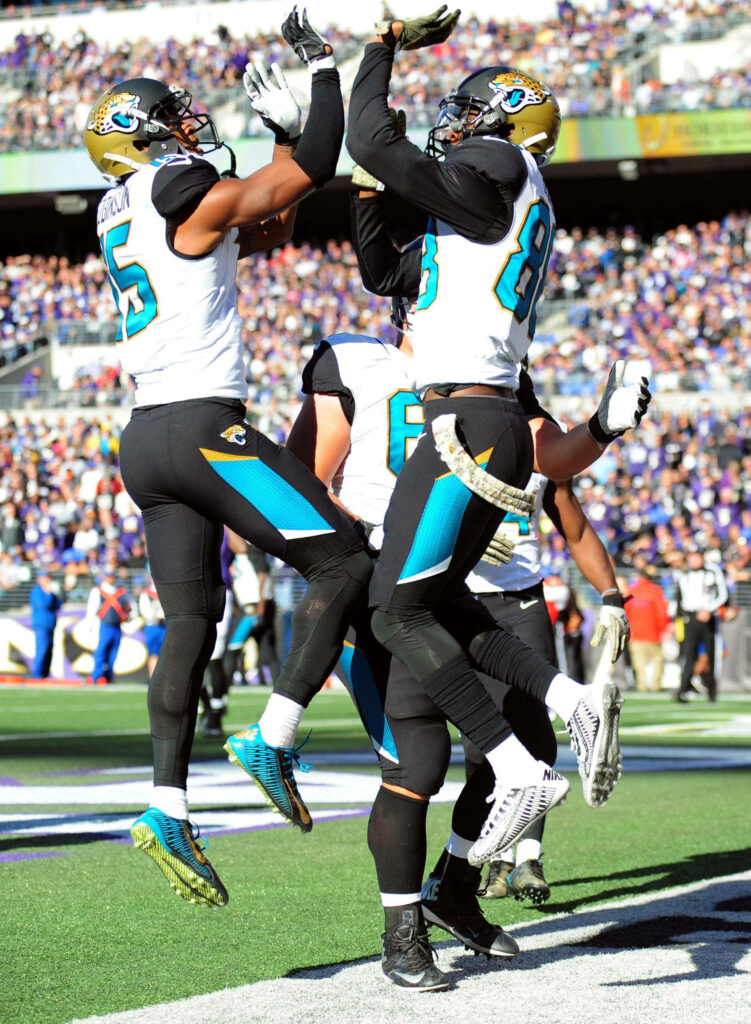 Vibrant NFL Wallpaper: Robinson & Hurns Celebrate Touchdown Together