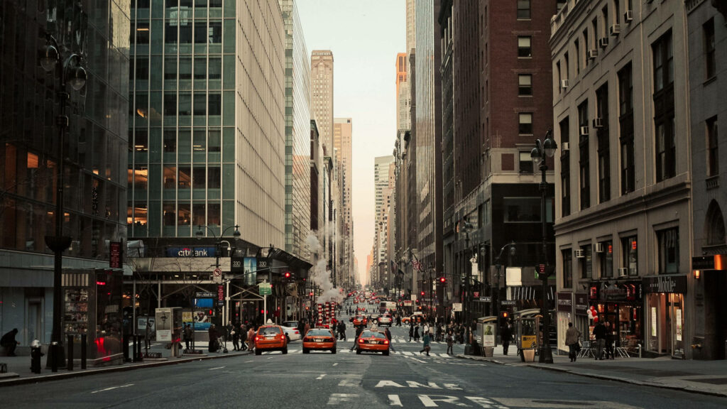 Vibrant NYC Street Scene Wallpaper: Taxis, Towers & Urban Buzz