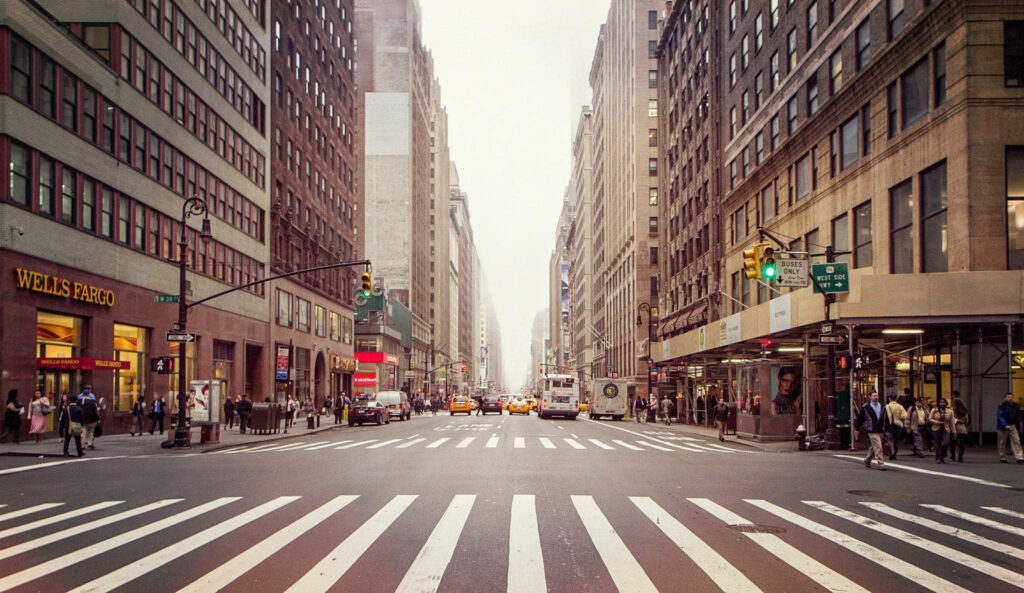 Vibrant NYC Street View Wallpaper: Taxis, Crosswalks & Tall Buildings