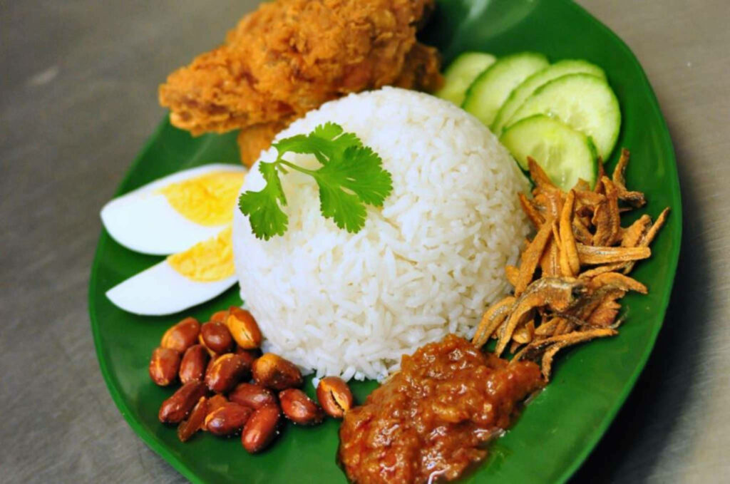 Delicious Nasi Lemak Close-Up: Rice, Sambal & Crispy Chicken Wallpaper