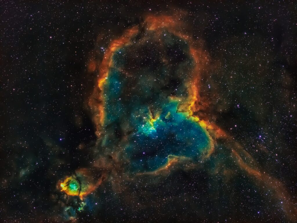 Vibrant Nebula Wallpaper: Orange, Blue & Green Cosmic Beauty