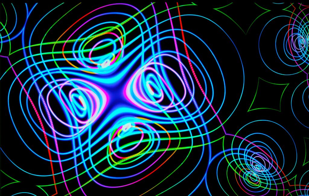 Vibrant Abstract Neon Wallpaper: Colorful Wavy Patterns on Dark Background