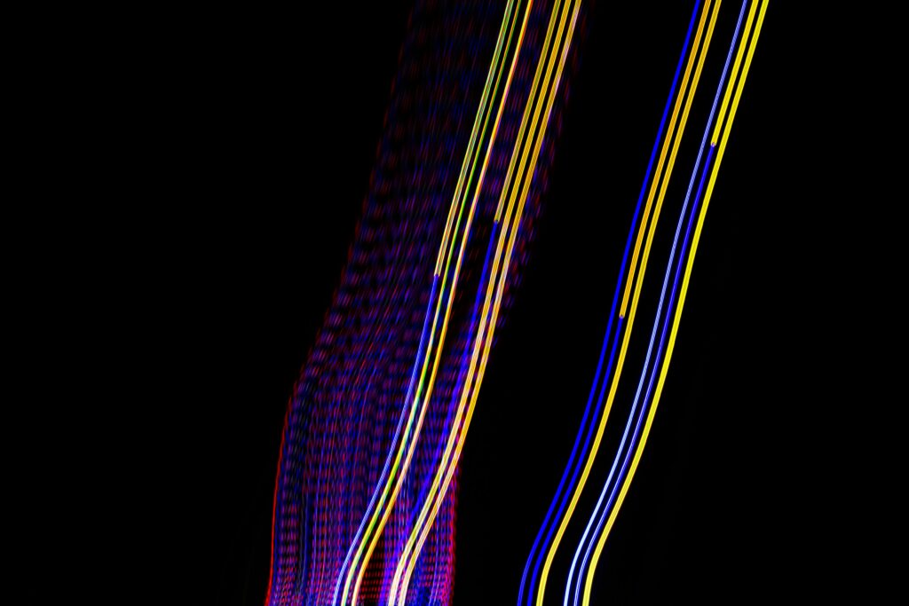 Vibrant Neon Abstract Wallpaper: Dynamic Lines on Dark Background