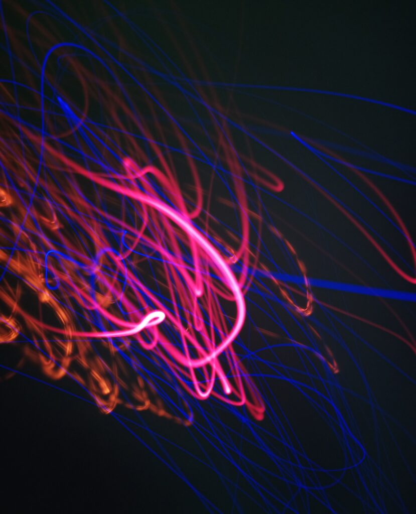 Vibrant Neon Abstract Wallpaper: Swirling Pink, Blue & Orange Design