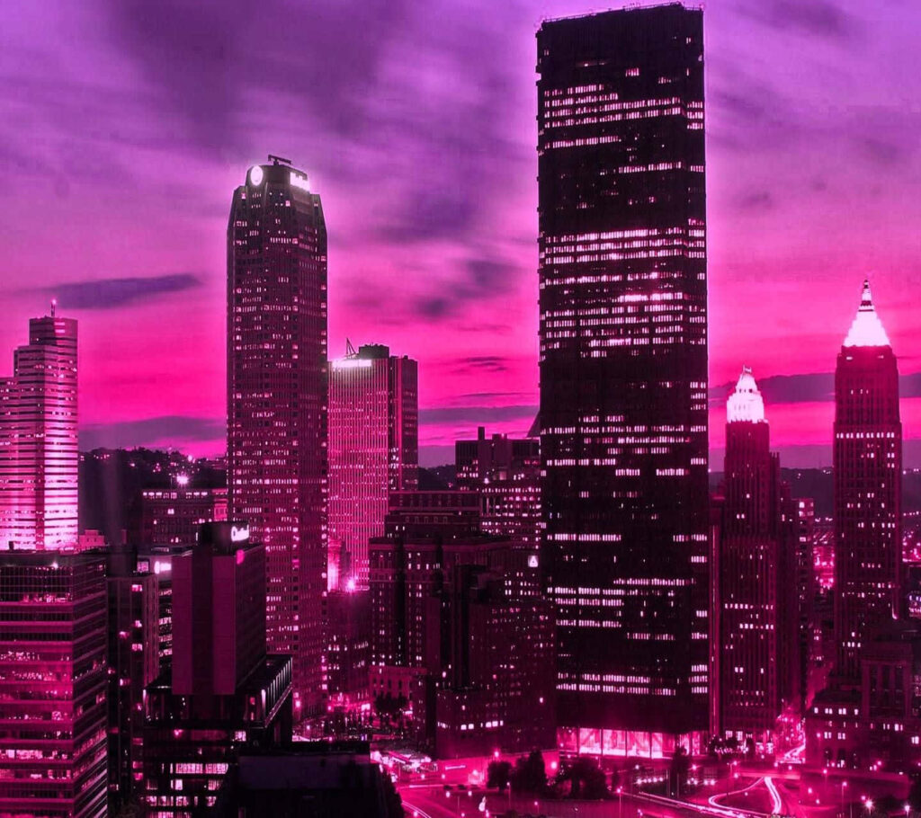 Vibrant Neon Cityscape Wallpaper: Towering Buildings at Dusk