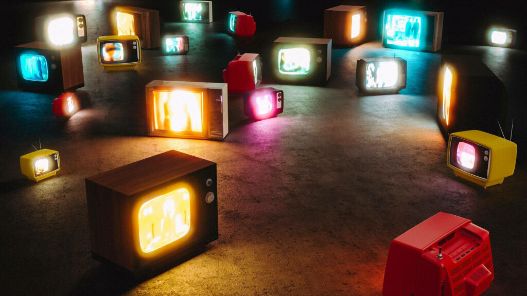 Vibrant Neon TV Screenscape: A Cubic Lampshade in a Colorful Studio Wallpaper